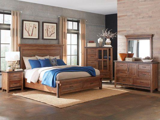 Storage drawers in the foot board in this rustic contemporary "Taos Collection" solid wood bedroom set