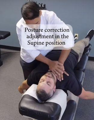 Posture corrective adjustments of the shoulders, head and ribcage in the supine position