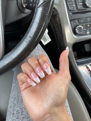 Uneven lengths and super short nails beds. The tips were glued too far back