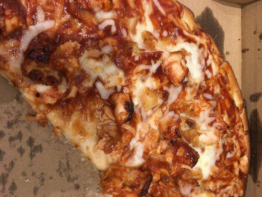 part of medium sized bbq chicken pizza