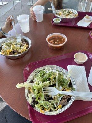 Patio area, 2 steak burrito bowls, one chicken burrito bowl, their salsa and the Mary's Tex-Mex sauce