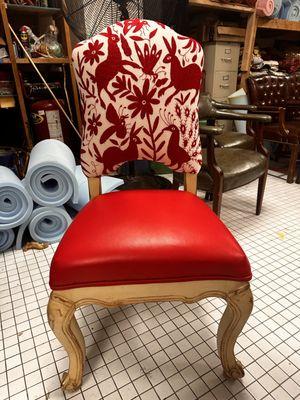 Hand embroidered Mexican Otomi textile on the back and s oft red leather on the seat, can something be more charming than that!?