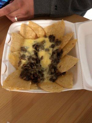 This is what you get for $13 steak Nachos Jalisco 's.... would never order from here again poor quality poor everything.