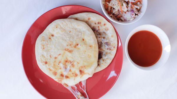 All our pupusas are served with hot sauce and house curtido.