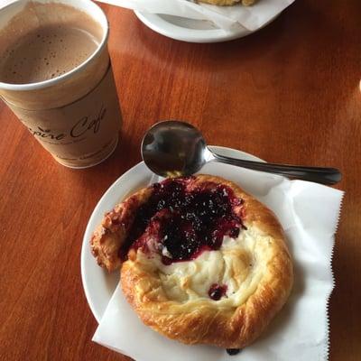 Danish with half blackberry jam and half cream cheese with a dark chocolate mocha