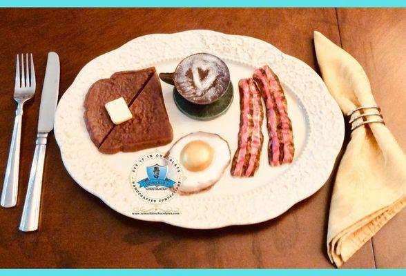 Chocolate breakfast plaster with toas and butter, eggs , bacon and coffee. A great way to start your day!