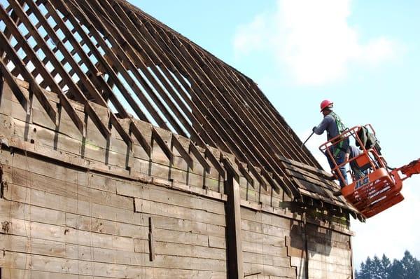 DeConstruction Services at work on an old Vancouver barn. Up to 85% of a building's components can be salvaged for reuse.