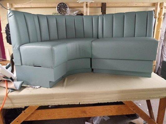 Curved banquette with storage