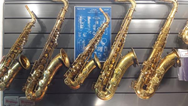 A wall of Vintage Selmers! Selmer Mark VI, SBA, Selmer Model 28