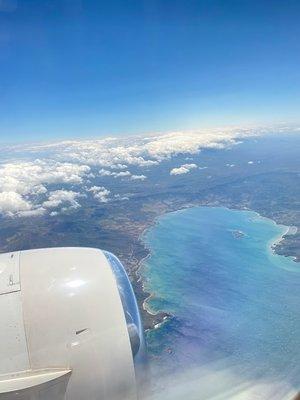 Airplane flying over water 
Taken by: Michelle Tapia