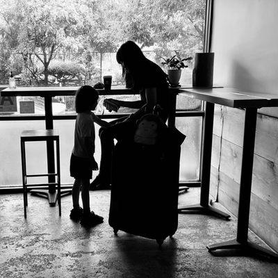 Silhouettes seated in the corner. Interior