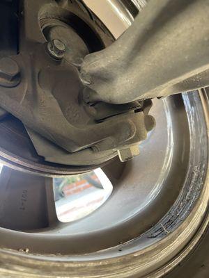 Damages to inside of rim and to lower ball joint