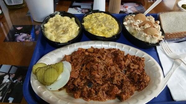 1 meat dinner plate comes with 2 sides.  Chopped beef,  mac and cheese, broccoli rice,  and banana pudding to share