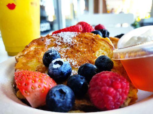 Morning Glory  w/ fresh berries. Perfectly cooked french toast. Vegan & gluten free options as well. Just ask.