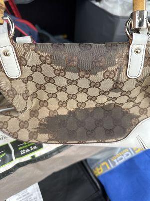 My high end purse with oil stains caused at Johnnys Shoe Repair Shop