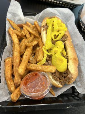 Small cheesesteak with onions, Cooper sharp, banana peppers, sauce on the side.