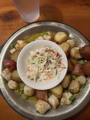 Scallop special with grilled red potatoes, hush puppies and coleslaw.