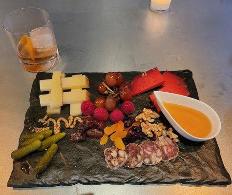 The last sips of Matisse' special Old Fashion, accompanied by a delicious charcuterie board that I selected.