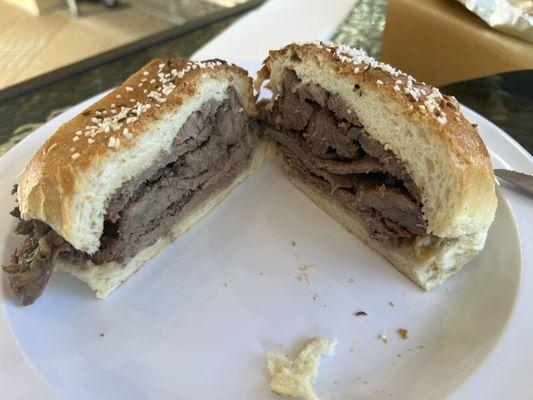 Beef on kummelweck bread with horseradish. Moist, Smokey, amazing taste.