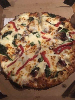 Pan pizza with Alfredo sauce, roasted red bell peppers and Philly steak