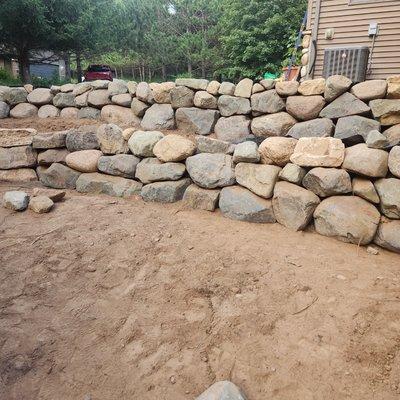 Boulder retaining wall