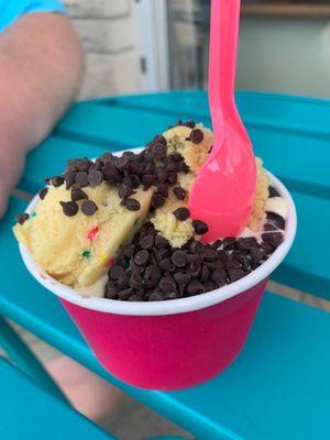 Medium- half cake batter half chocolate, filled with two scoops of cookie dough and mini chocolate chips.