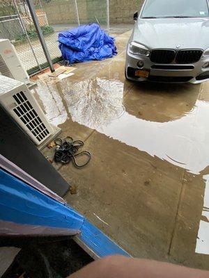 Completely flooded backyard. Due to a bad pitch in sewer line.