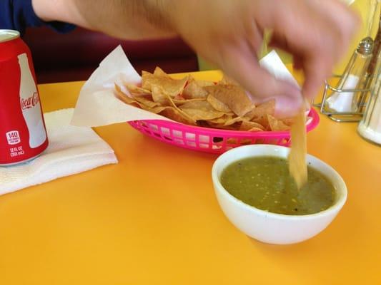 Chips and green salsa.