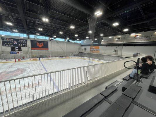 View from the second floor. Skaters getting ready on the first floor in the opposite corner