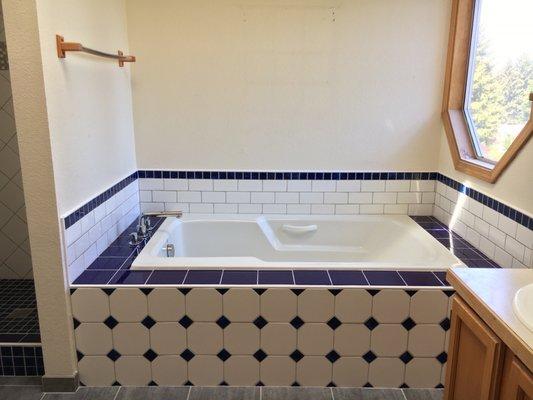 This is our new tub with custom octagonal tiles. The tile guys had quite a struggle with that, but they cut them out perfectly.