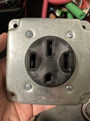 Discolored Leviton NEMA 14-50R.