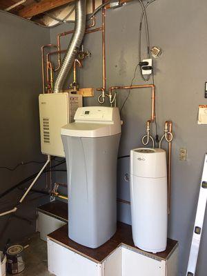 Water filter, water softener and new tankless water heater installation.