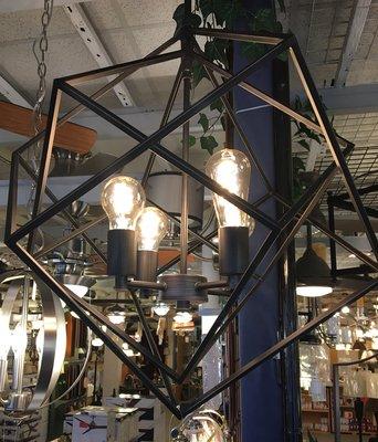 Geometric cage light with vintage light bulbs.