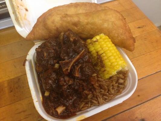 Oxtail, peas and rice, corn, and saltfish pate. Absolutely delicious!