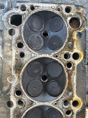 Pulled off block, the cylinder head before breaking down debris/old grime. 294k at service.