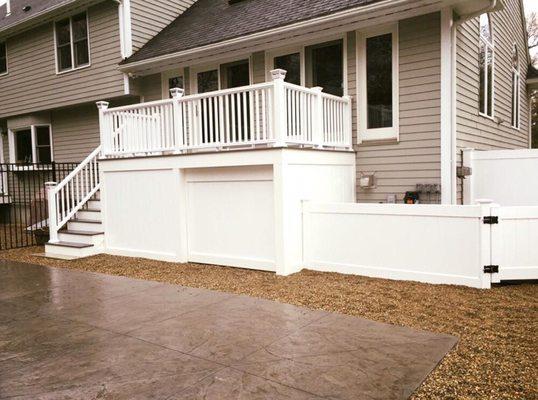 New maintenance free deck with sliding barn door and surround to hide pool pump.