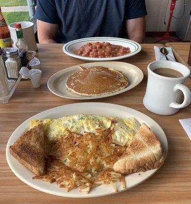 Omelette, blueberry pancake, and tomato gravy over rice