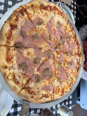 Regular pizza with sausage and Canadian bacon. Very tasty!