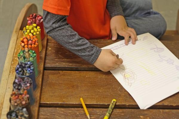 Coloring and writing supplies are set out for kids to use whenever the mood strikes them.