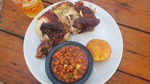 Half Chicken (white) with one side of baked beans.