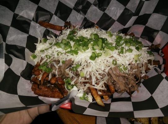 Poutine with braised beef gravy with aged white cheddar. Would like to see cheese curds.