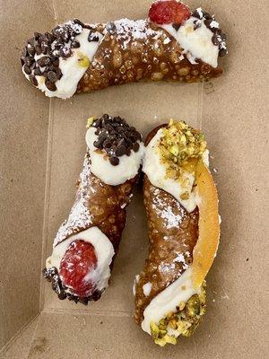 Raspberry and chocolate cannoli and pistachio and candied Orange cannoli