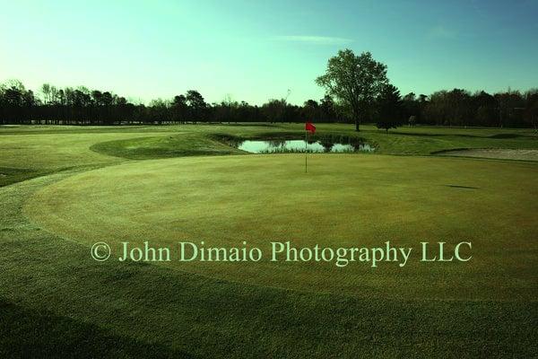 9th hole looking back from 9th green. Large pond in front of hole and bunkers make it a tough par 3.