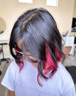 My daughter with her peekaboo pink highlights. She loves it!