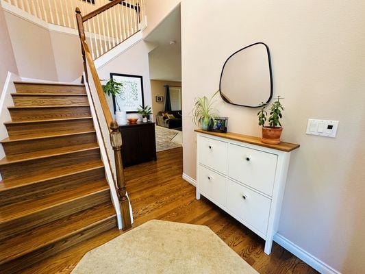 Current foyer. As the kids grow a bit we will change the brown cabinet to a beautiful velvet green chair and floor lamp.