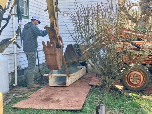 the chute they built to pour gravel into the hole in the crawl space