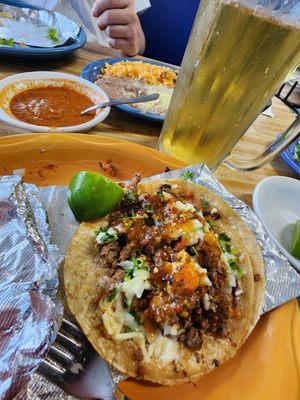 El pastor tacos, cold Beer  and bad ass salsa to make your hair smoke...(gotta ask)  Amazing flavor and portions that will not disappoint.