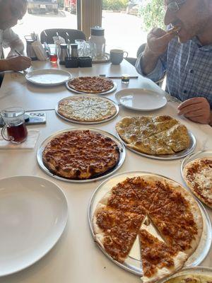 Variety of meat, veggie and cheese pies