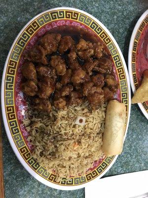 General Tso and fried rice with a spring roll.