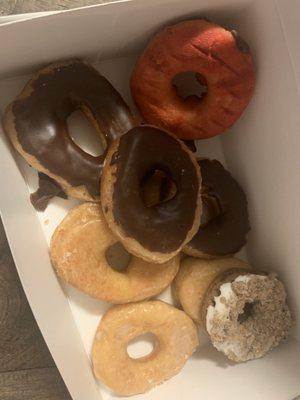 Yummy donuts! Choc. Glazed, regular glazed, blueberry w/ something on top, & strawberry with choc.